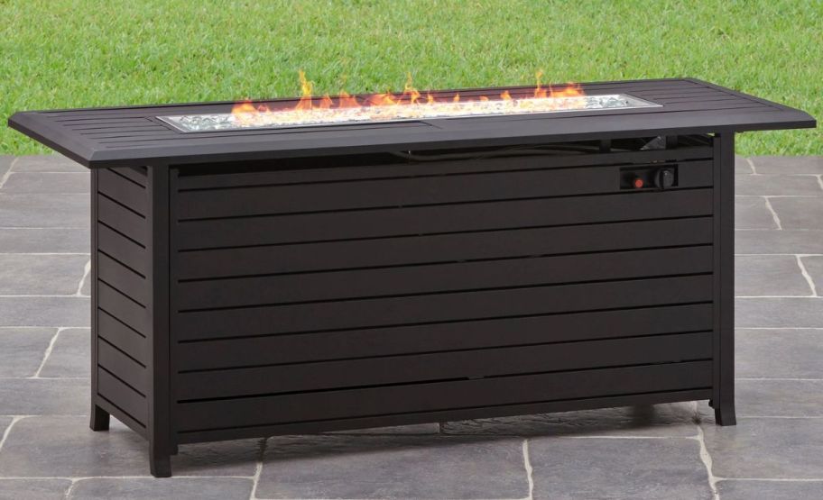 a large rectangular fire pit table on patio