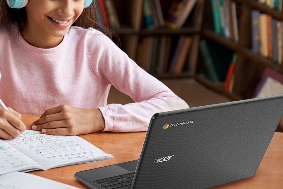 Girl using acer Chromebook to do school book-2