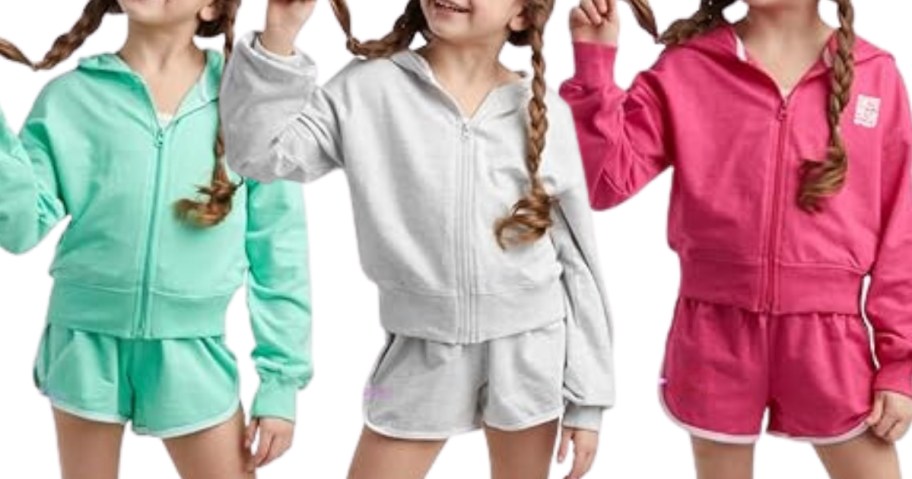 girls wearing green, grey, and pink hoodie and shorts sets