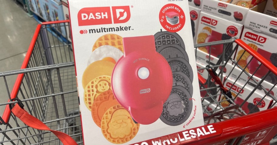 a red Dash MultiMaker Holiday Mini Maker System in the box in a Costco cart