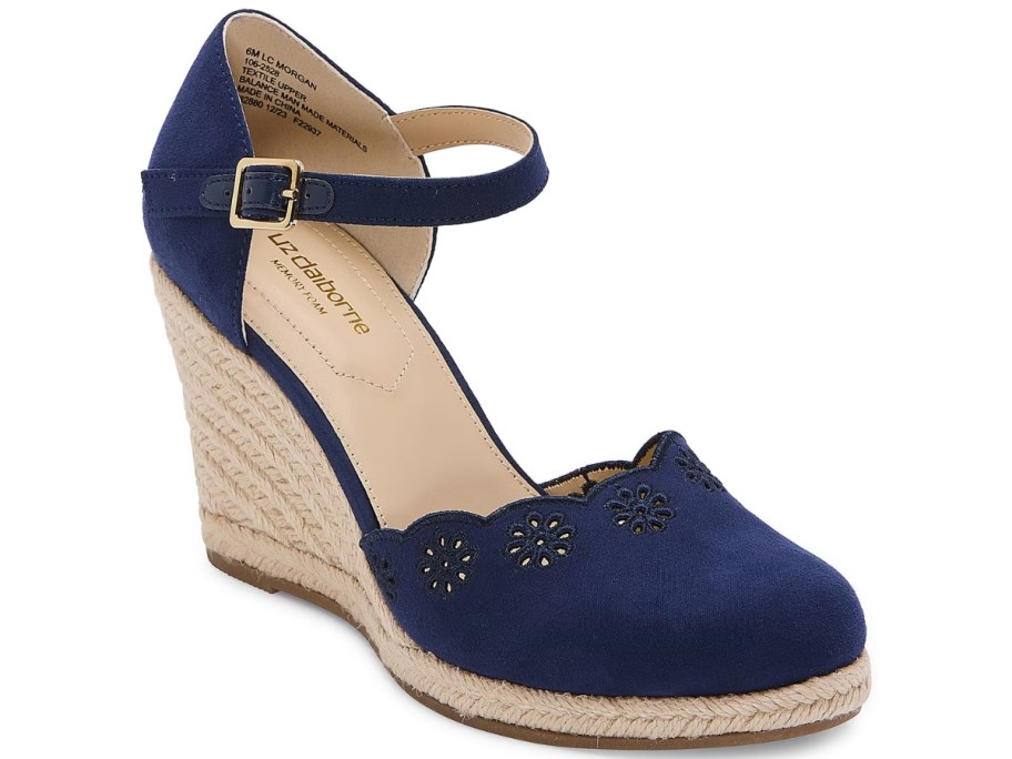 women's wedge sandal in navy and tan with floral cutout details