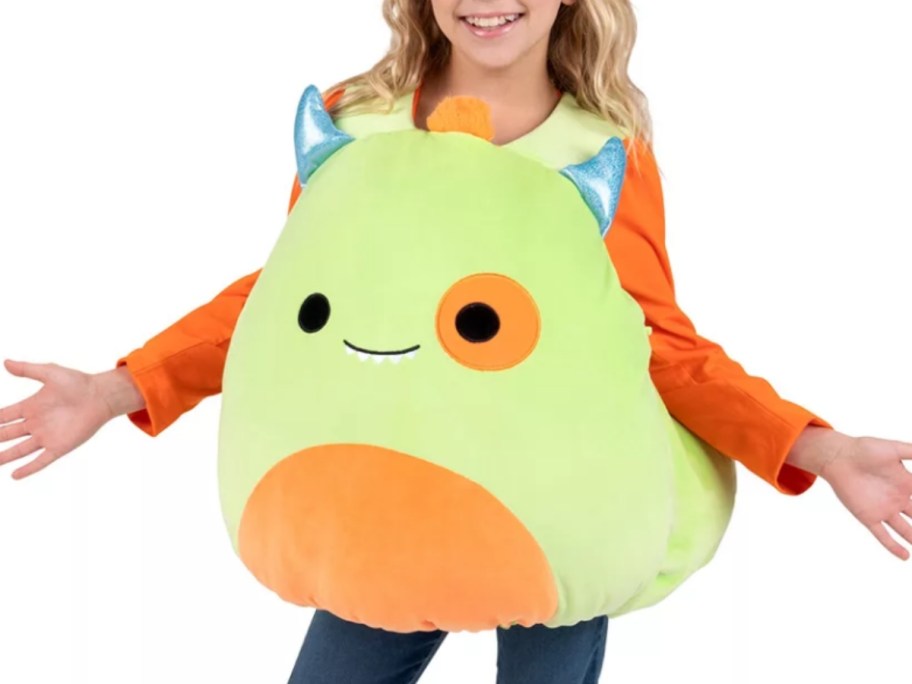 girl wearing a yellow, orange, and blue Squishmallow Monster Halloween costume