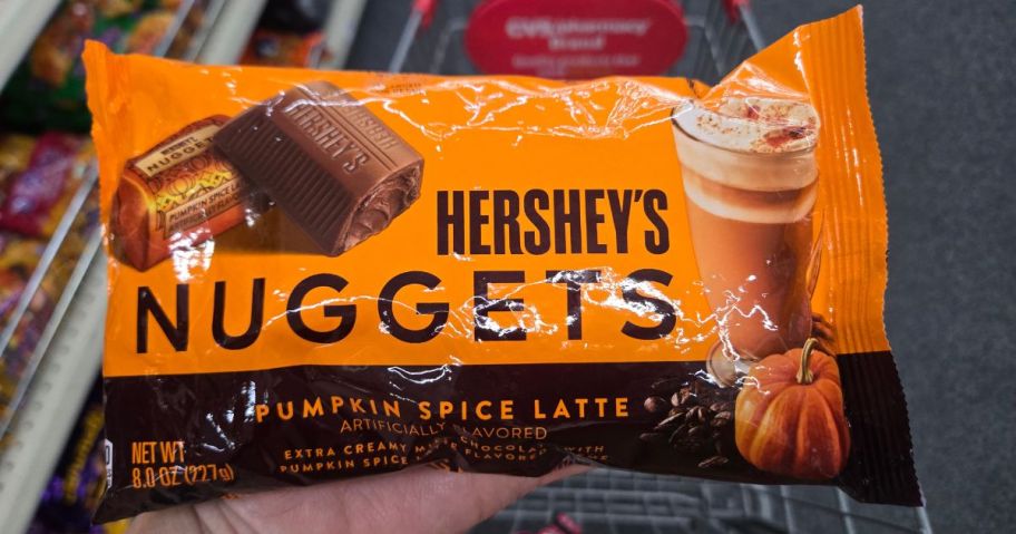 hand holding hersheys nuggets bag 