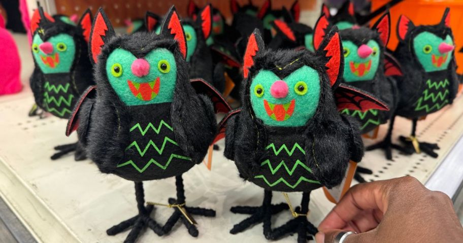 A shelf-full of Halloween-themed decorative birds at Target