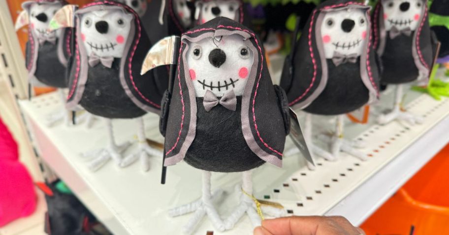 A shelf-full of Halloween-themed decorative birds at Target