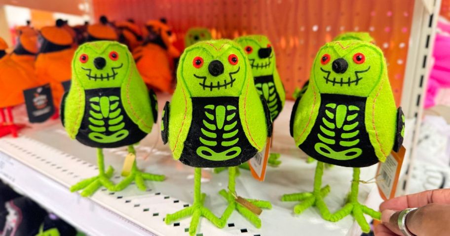 A shelf-full of Halloween-themed decorative birds at Target