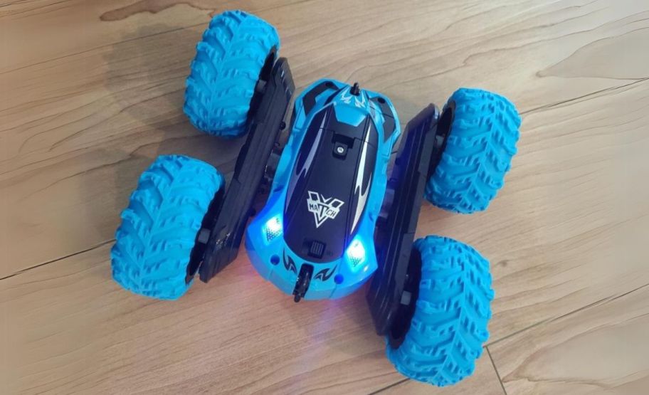 a blue double-sided remote control car on a hardwood floor