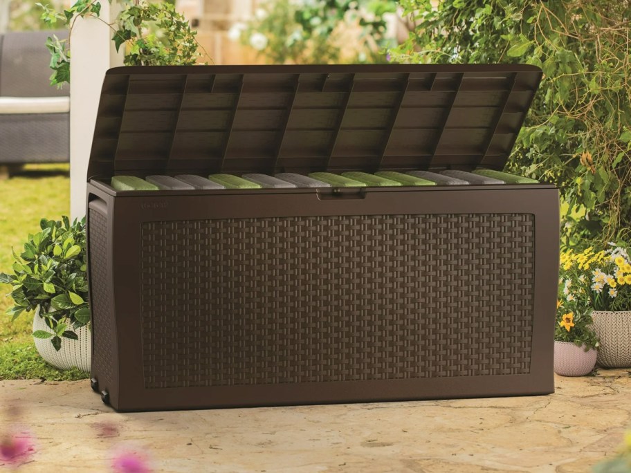 brown patio deck box with cushions inside