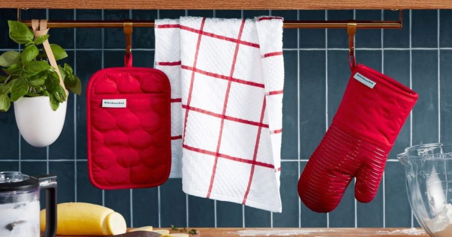 KitchenAid Quilted Cotton Terry Cloth Oven Mitt & Pot Holder Set in Passion Red hanging in kitchen