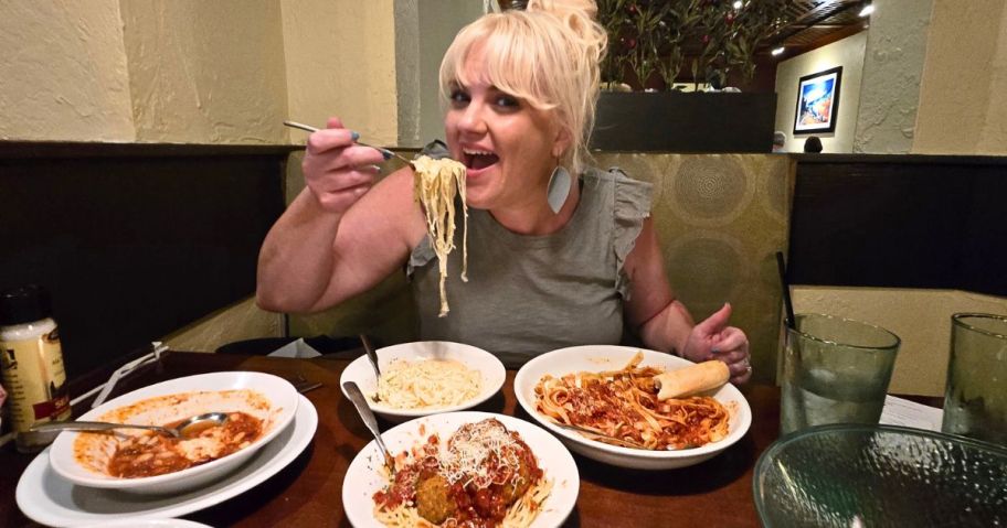 Woman eating pasta at an Olive Garden Restaurant