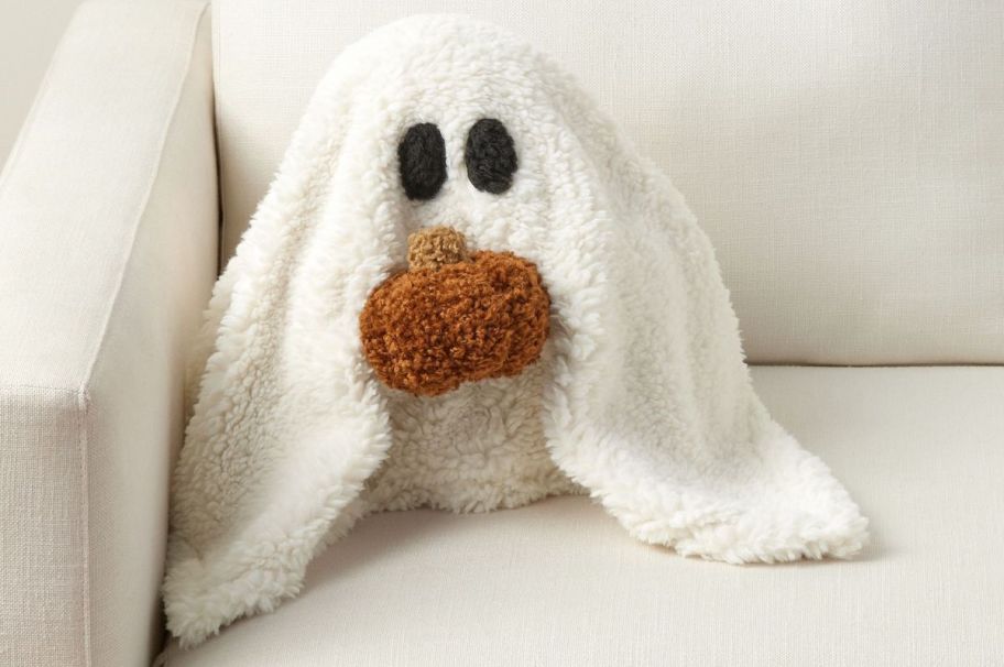 ghost sherpa pillow on white couch