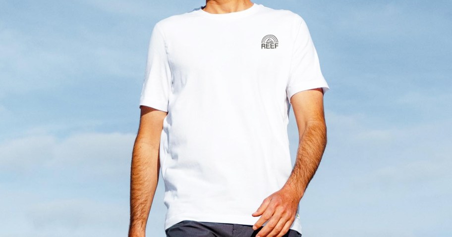 man wearing a white reef t-shirt