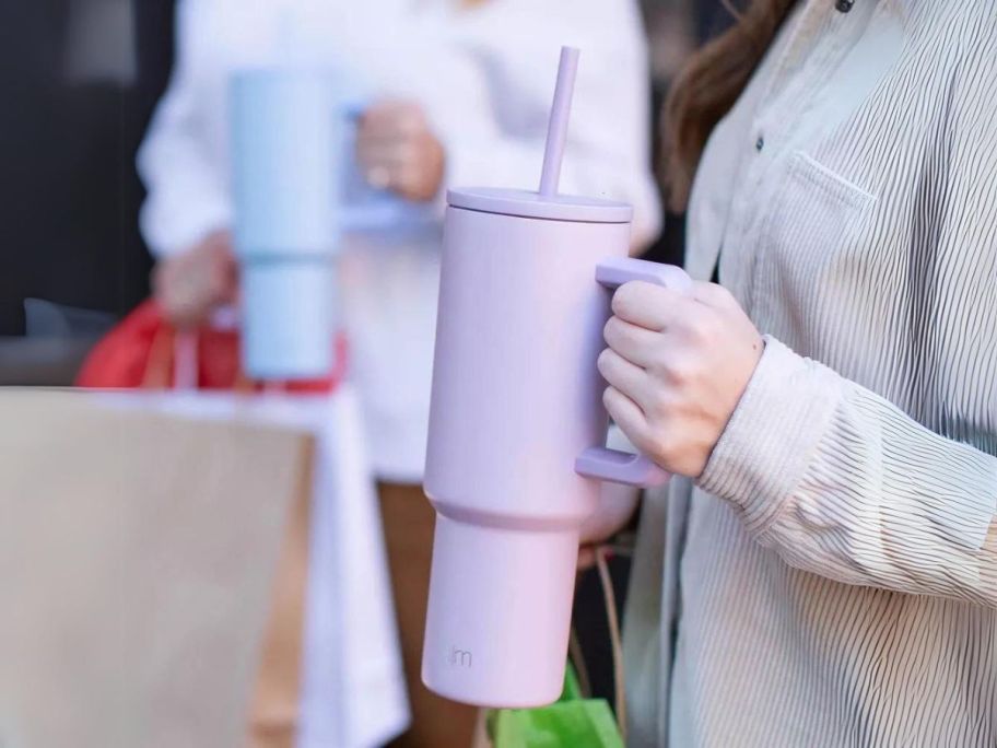 person holding Simple Modern Trek 40oz Tumbler