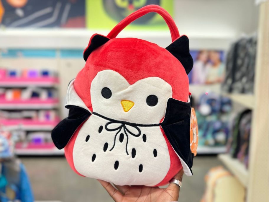 Squishmallows Demi the Vampire Owl Halloween Treat Pail in hand in store