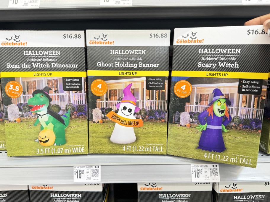 boxes of halloween inflatables on store shelf