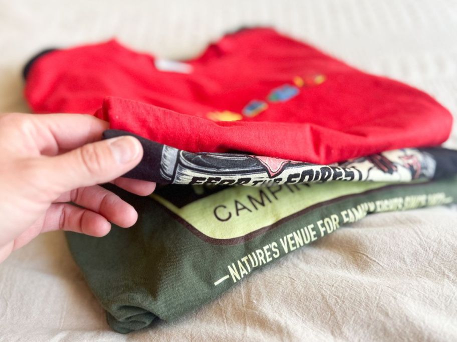 A stack of folded T-Shirts from Woot