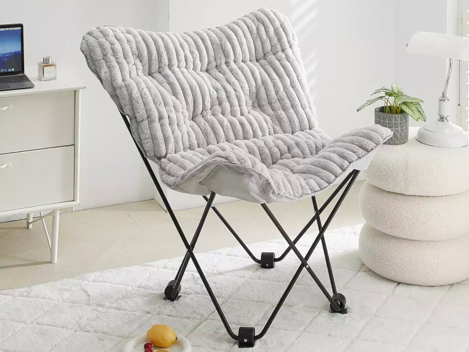 gray chair on white rug 