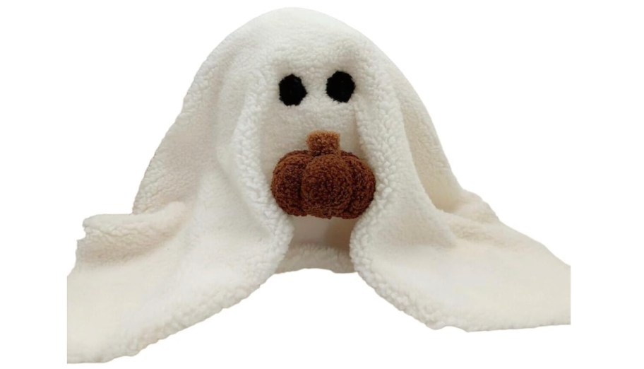 stock photo of ghost with pumpkin pillow