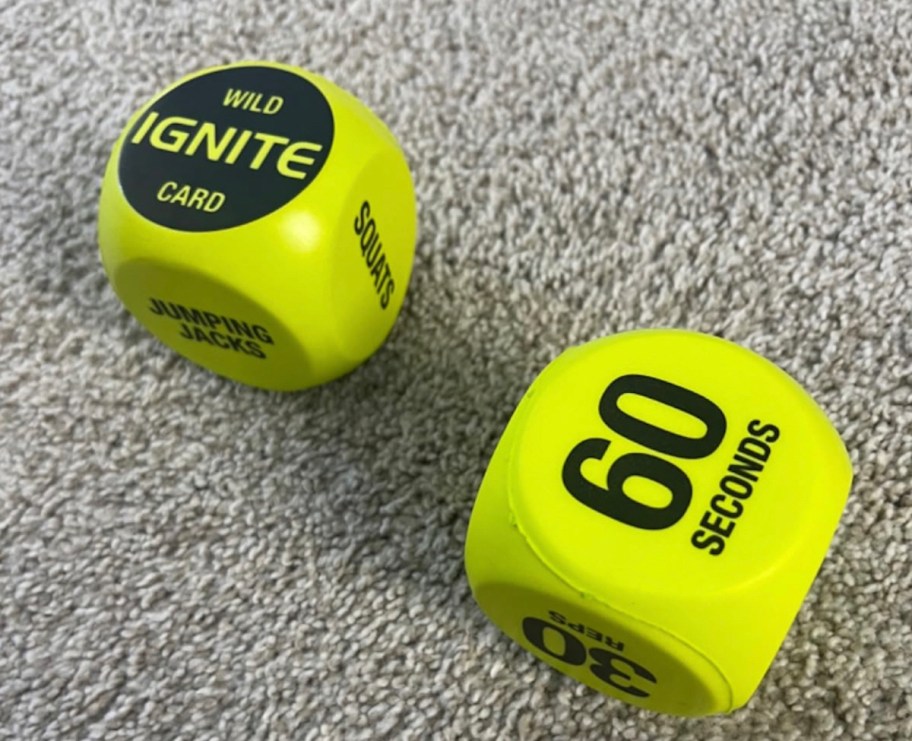 yellow foam exercise dice on carpet