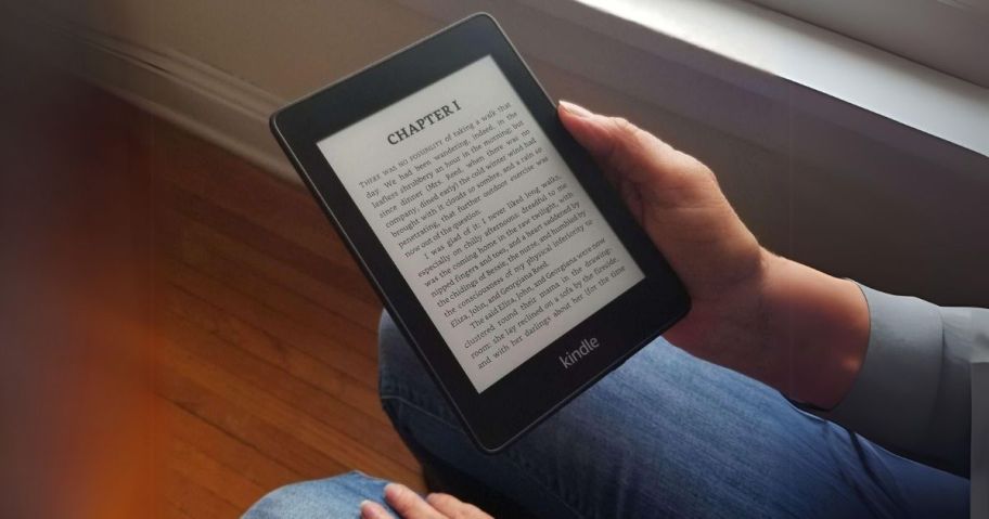 hand holding kindle near window