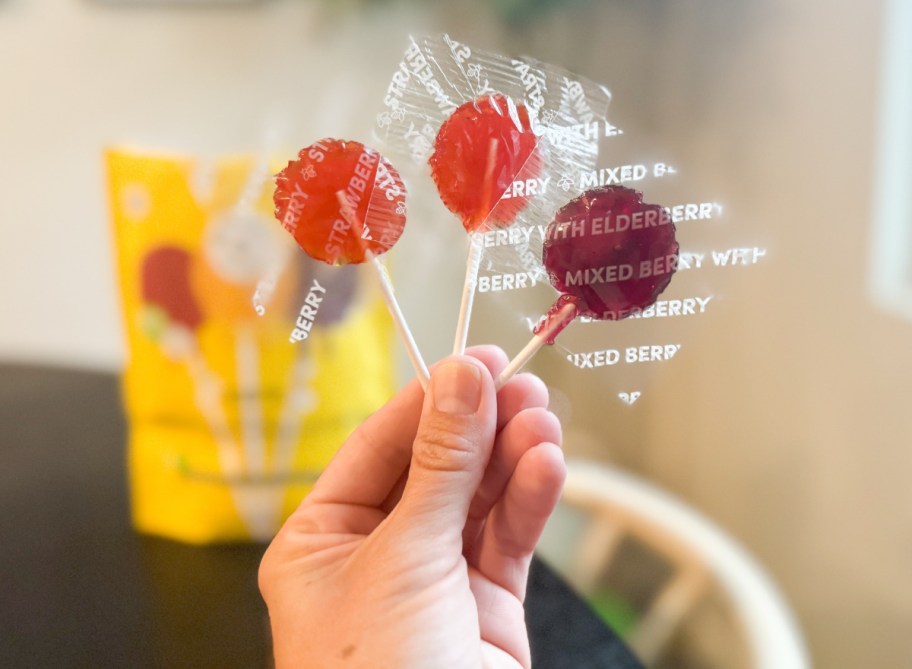 hand holding throat lollipops