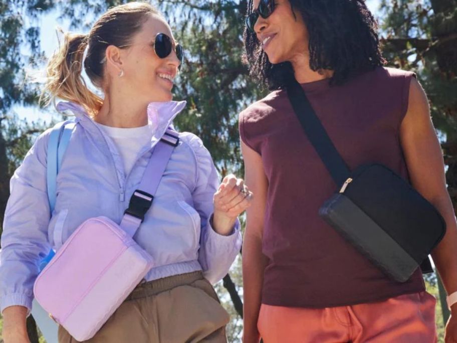 two women wearing bogg belt bags