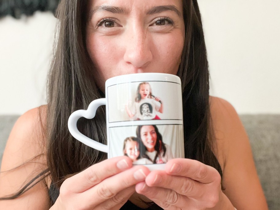 woman sipping from heart handle coffee mug