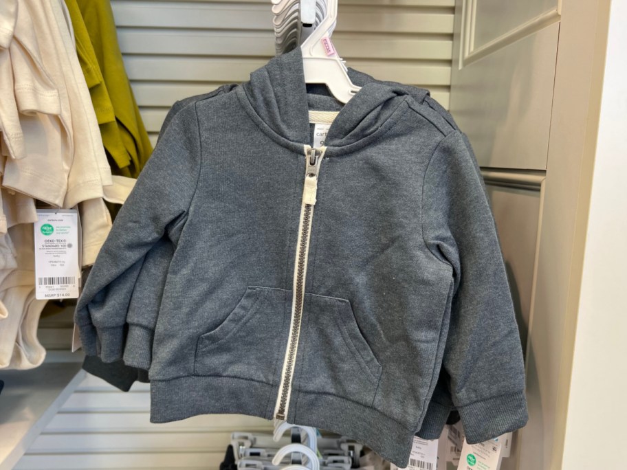 blue grey hoodie on hanger instore