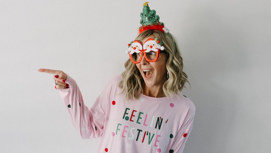 woman in feelin festive christmas jammies and glasses