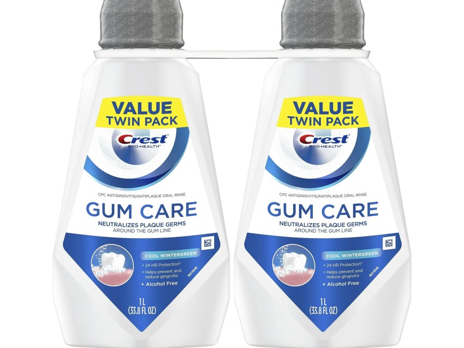 two crest gum care mouthwash bottles 