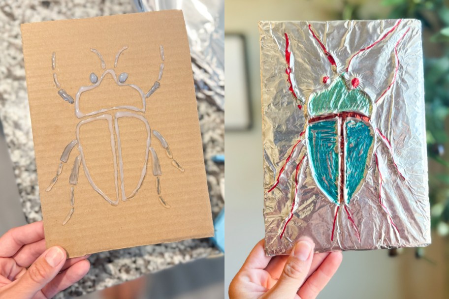 hand holding cardboard bug and colorful bug covered in foil
