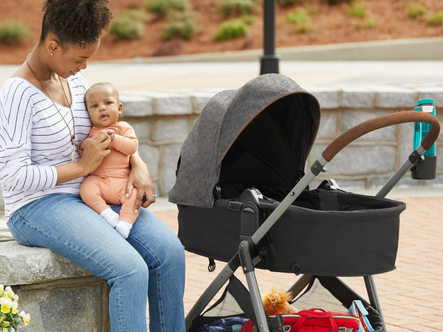 double stroller with kiddo on the side