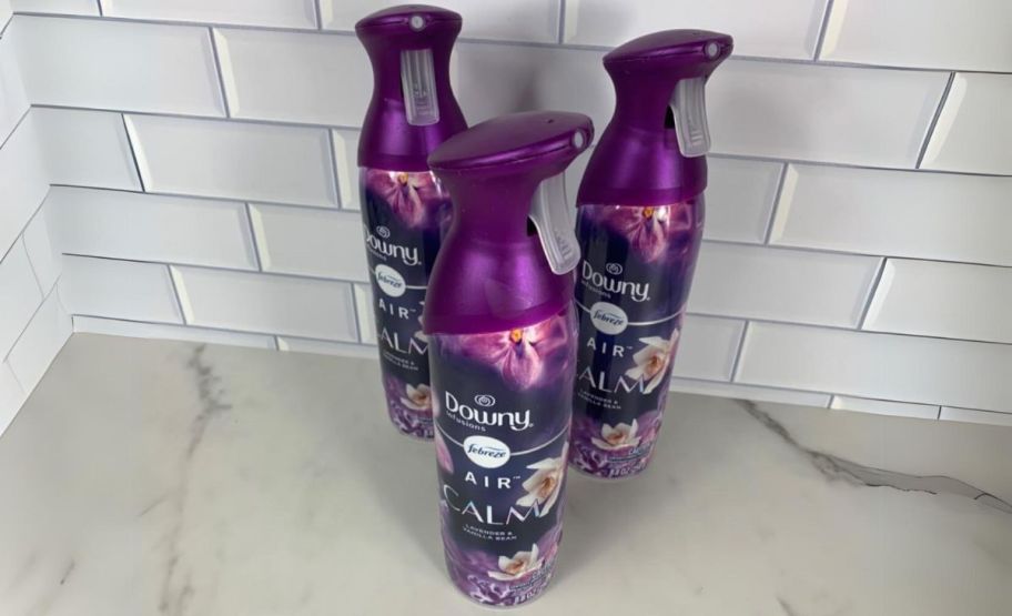 3 bottles of downy febreze calm on a kitchne counter