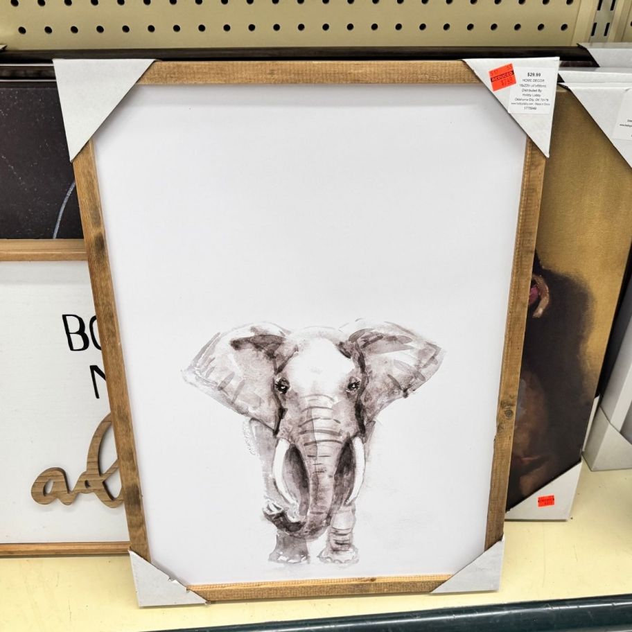 an elephant print in a wooden frame