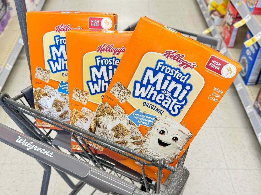 three boxes of frosted mini wheats in cart in store