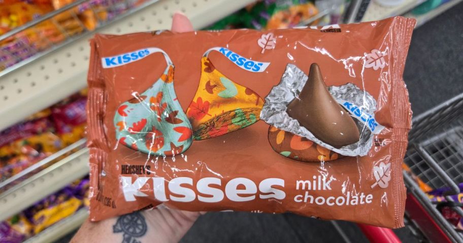 hand holding kisses harvest bag 