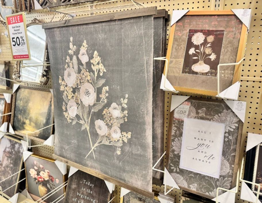 hobby lobby wall art on a display wall in a store