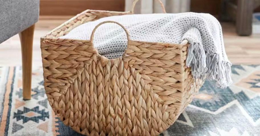 woven basket with blanket inside 