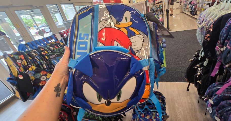 hand holding sonic the hedgehog backpack in store