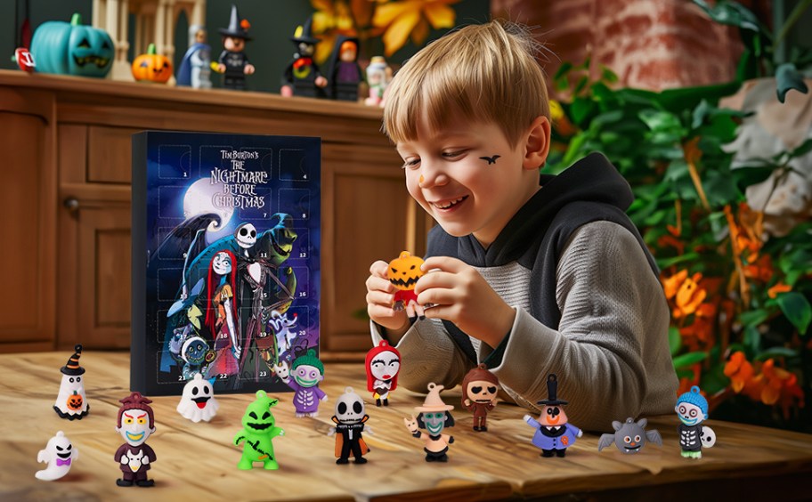 boy opening nightmare before christmas halloween countdown with toy figurines