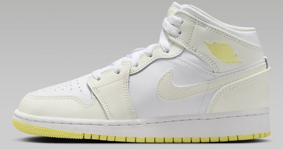 kid's Nike Air Jordan mid shoe in white with off white and light yellow accents