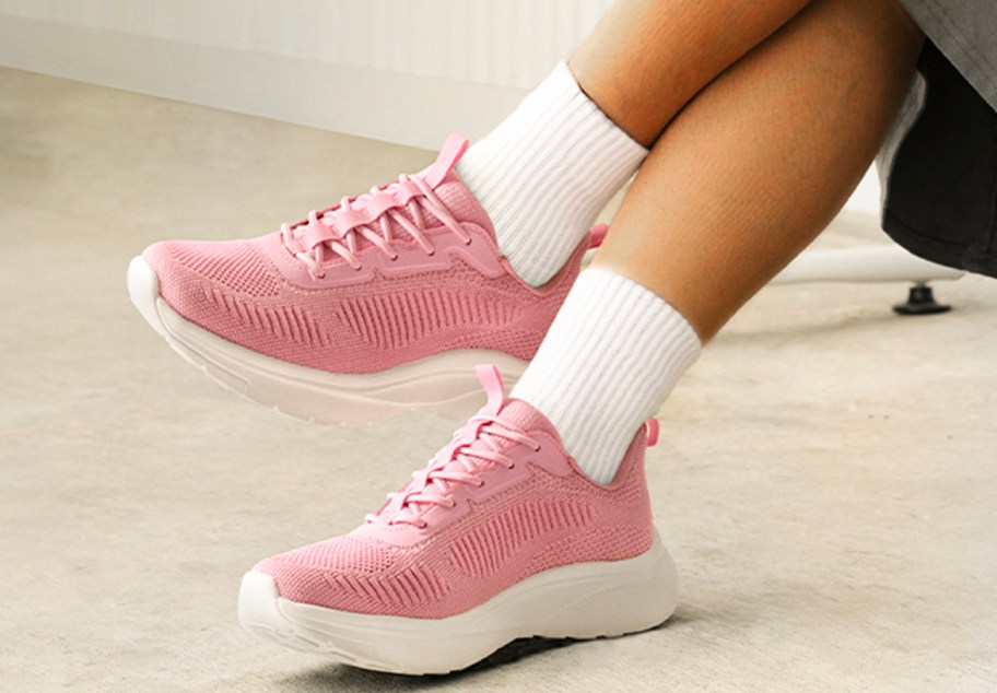 woman wearing pink shoes and white socks 