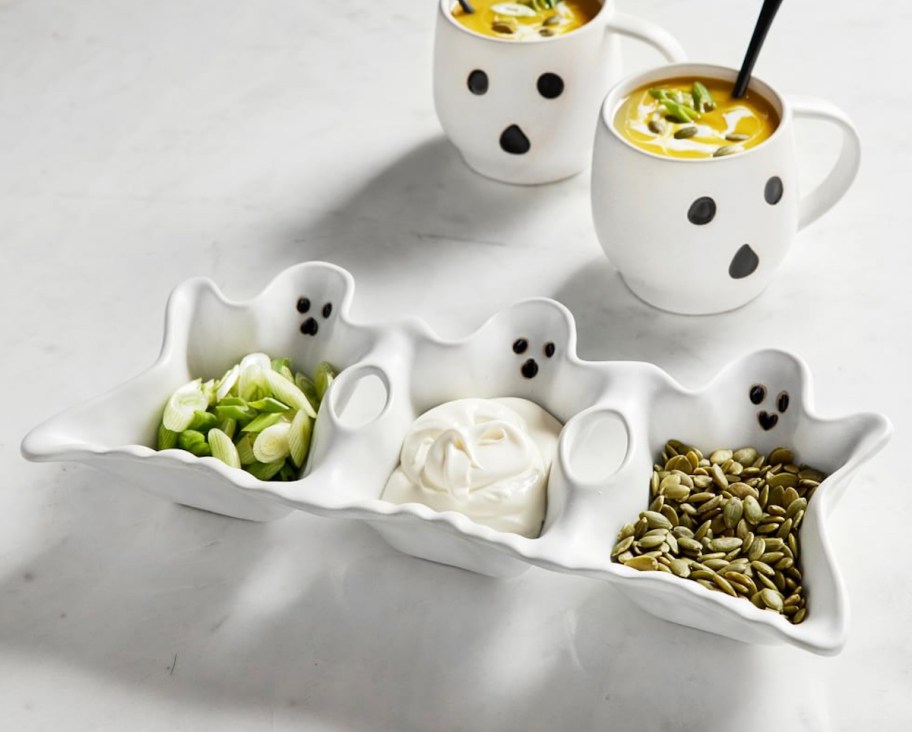 ghost condiment plate on countertop with ghost mugs