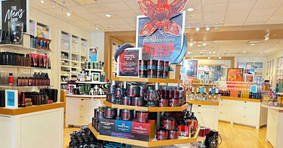 display with stranger things candles and products on it in bath and body work store