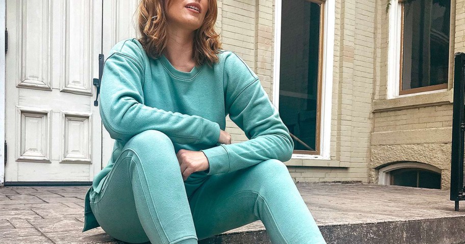 woman wearing teal sweater and sweatpants