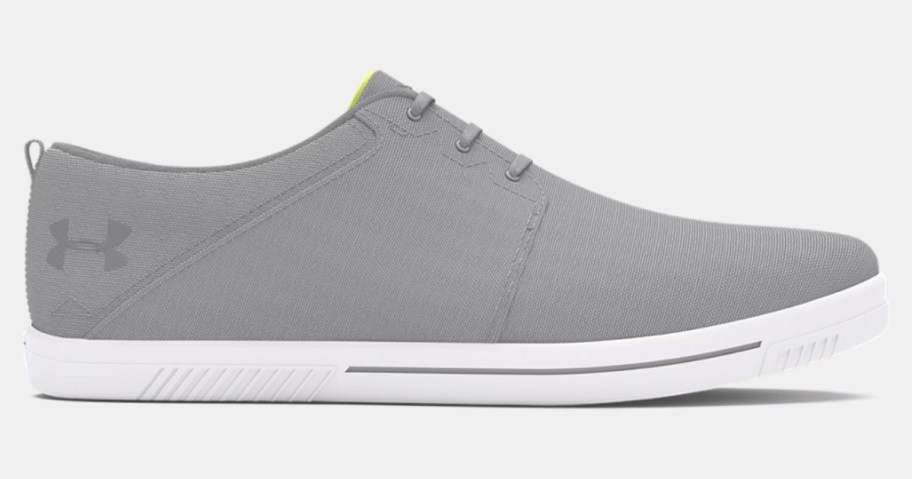 a grey and white Under Armour adults casual sneaker