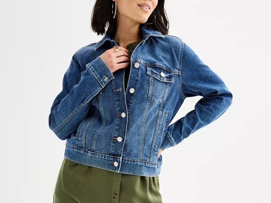 woman wearing a blue jean jacket 