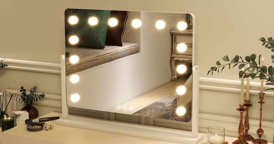 A BEAUTYPEAK 20"x16" Hollywood Vanity Mirror on a table