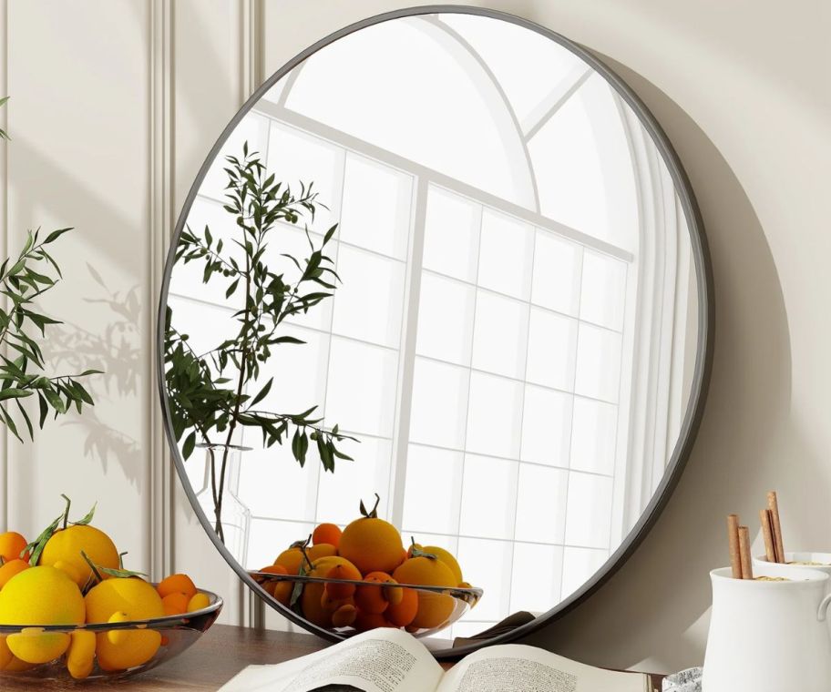 A round mirror on a wall