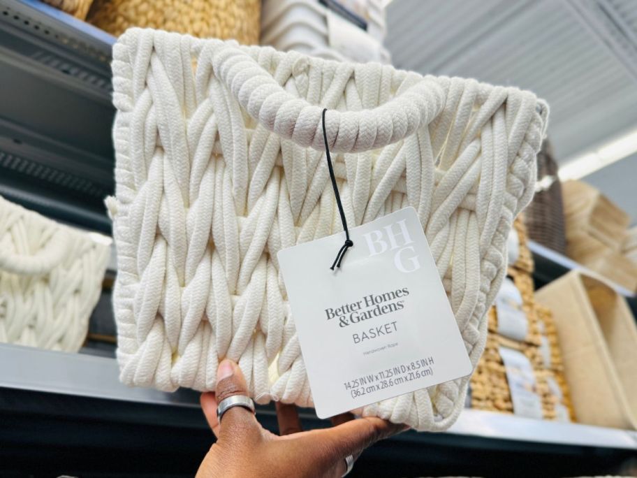 Better Homes & Gardens Medium White Woven Rope Decorative Storage Basket in hand in store